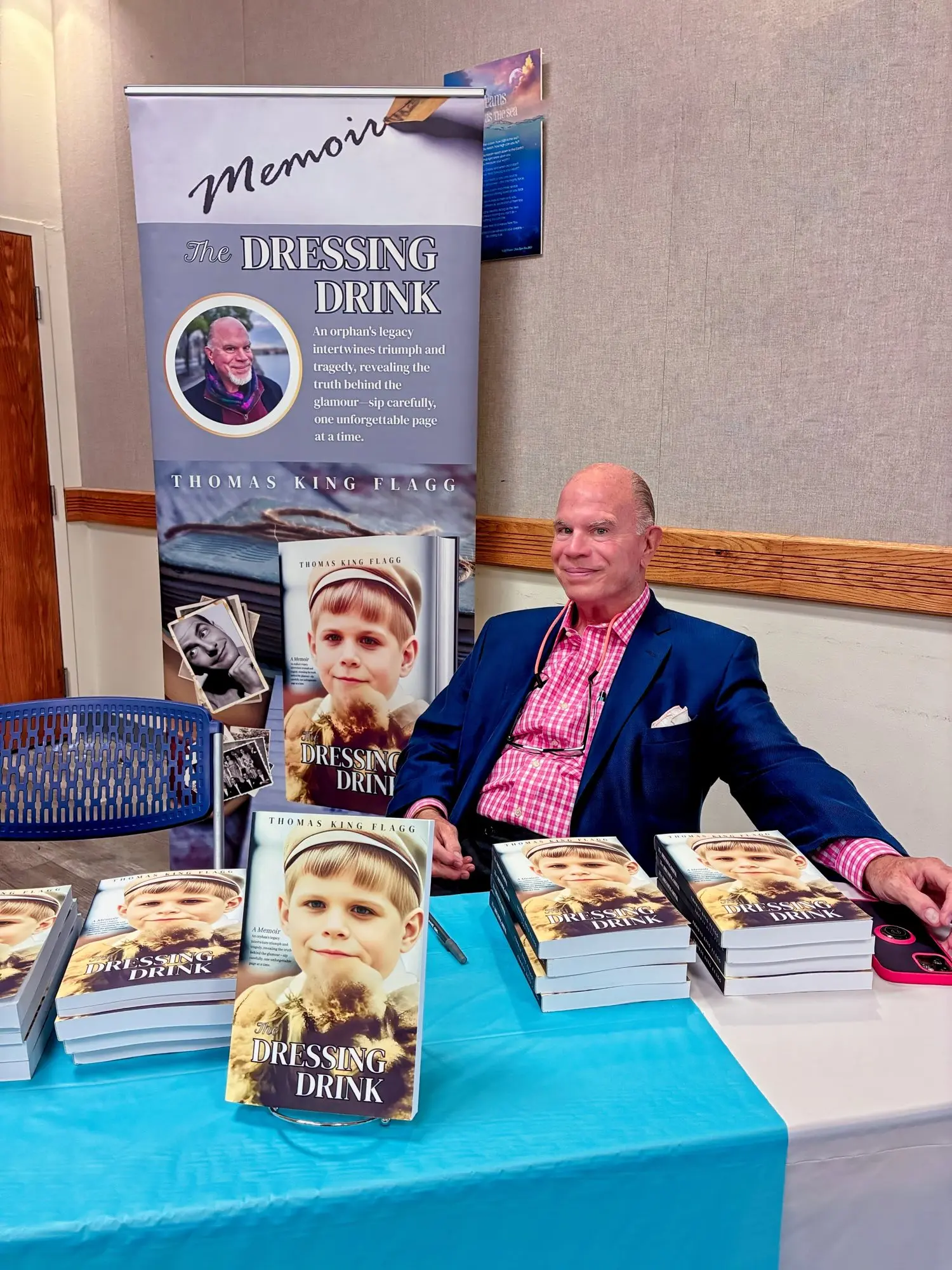 Thomas King Flagg at a book signing with his memoir The Dressing Drink on display